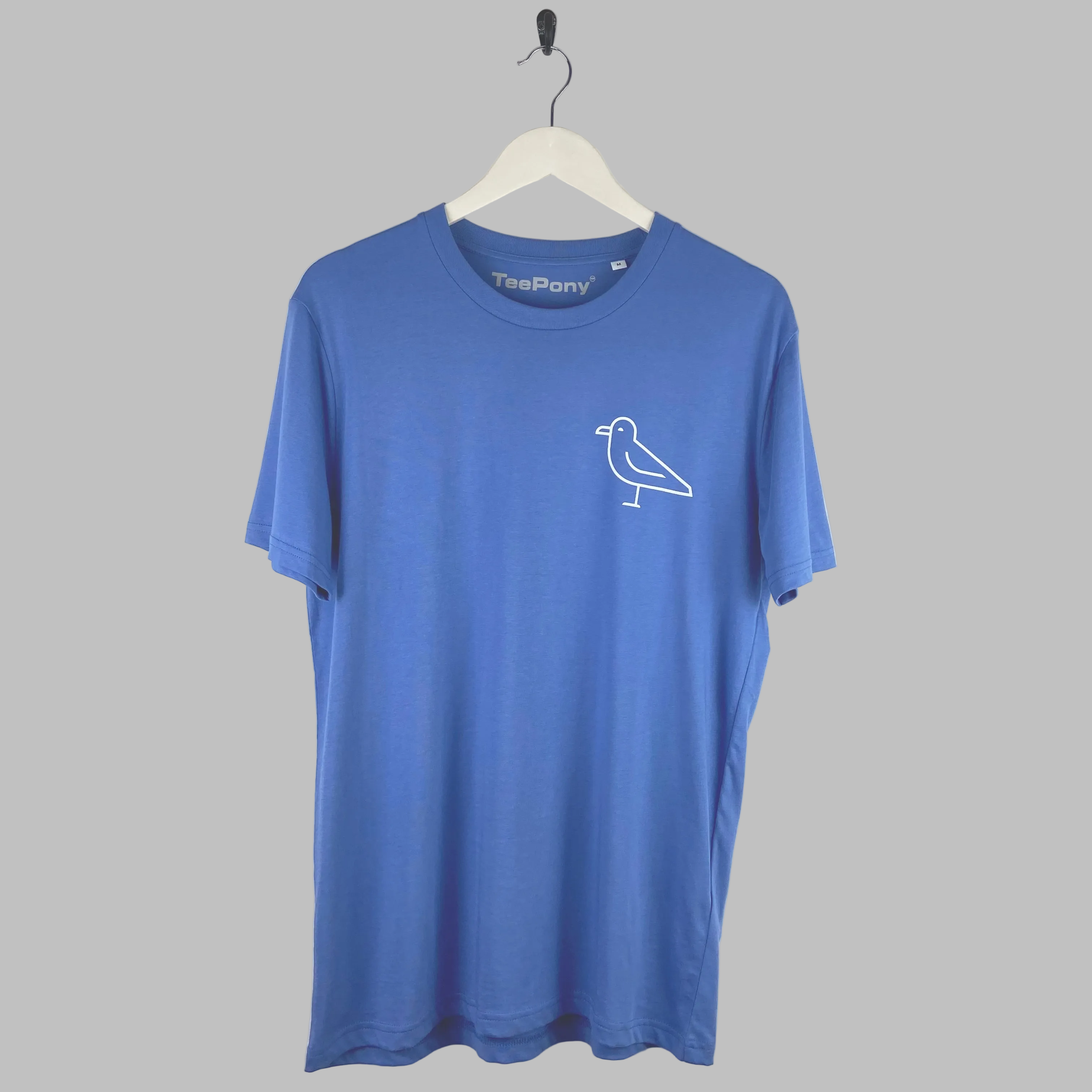 White seagull design on a blue t-shirt. Limited edition and hand printed in Brighton.